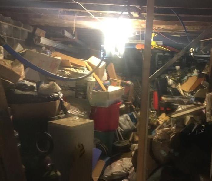 Hoarded Basement affected by water