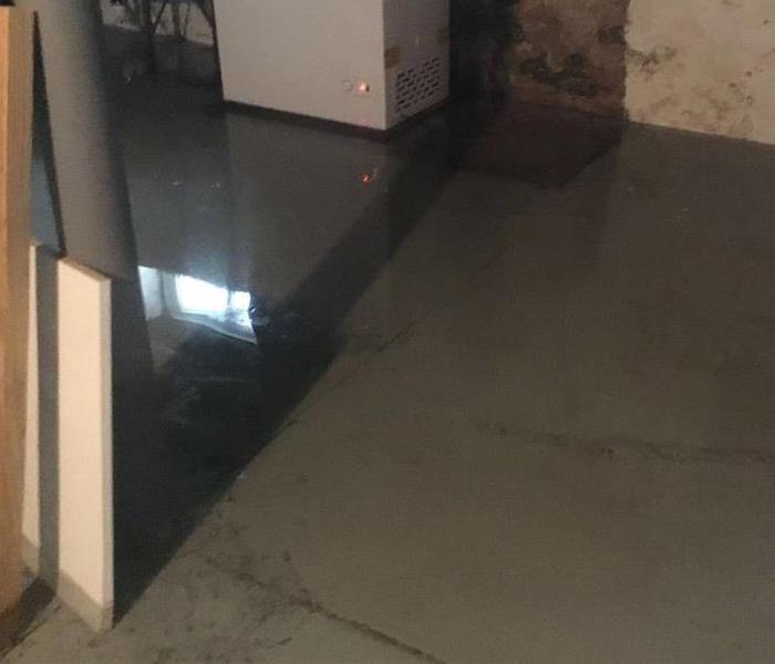 Unfinished basement with 2 ins deep standing water