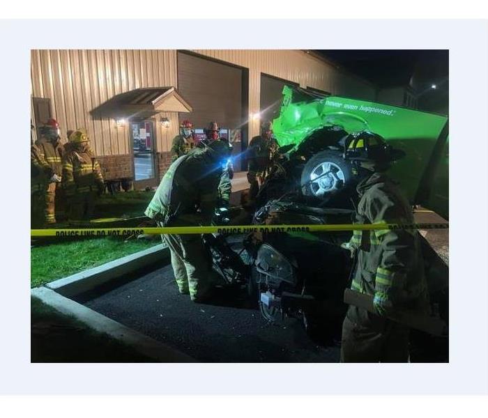 Firefighters training on a mock car accident