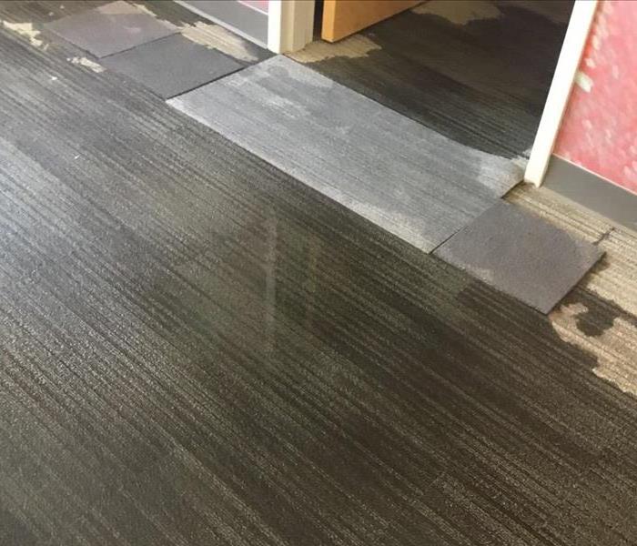 Carpet tiles saturated by water